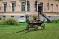 Wheelbarrow full of colorful flowers on a grass lawn Royalty Free Stock Photo