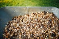 wheelbarrow full of wooden mulch