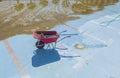 Wheelbarrow at pool bottom Royalty Free Stock Photo