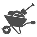 Wheelbarrow with soil and shovel solid icon, gardening concept, whell barrow and spade vector sign on white background