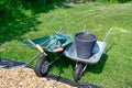 wheelbarrows ful of garden tools on lawn