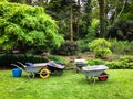 Wheelbarrows in garden ready for use Royalty Free Stock Photo