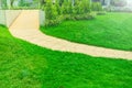 Wheelchair access ramp was built in a park with a bright green lawn, green grass with a disabled path the park landscaping garden Royalty Free Stock Photo