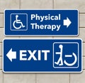 A wheelchair accessible sign points the way to physical therapy and pointing the other way toward the exit is a person standing Royalty Free Stock Photo