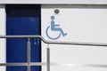 Wheelchair accessible toilet ramp rail sign public building