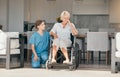 Wheelchair, assisted living or support with an old woman and caregiver in a nursing home for empathy. Pain, loss or Royalty Free Stock Photo