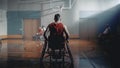 Wheelchair Basketball Game: Professional Player Prepairing to Play. He is Ready to Compete, Dribbl Royalty Free Stock Photo