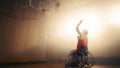 Wheelchair Basketball Player Wearing Red Uniform Shooting Ball Successfully, Scoring a Perfect Goa Royalty Free Stock Photo