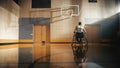 Wheelchair Basketball Player Wearing White Shirt Standing on a Basketball Field, Remembers the pas Royalty Free Stock Photo