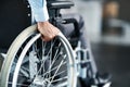 Wheelchair, disability and man hand holding wheel in a hospital for healthcare. Disabled, mobility problem and male