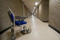 Wheelchair in an empty NHS hospital corridor Royalty Free Stock Photo