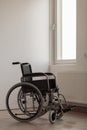 Wheelchair in empty room Royalty Free Stock Photo