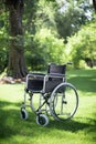 Wheelchair in the garden Royalty Free Stock Photo