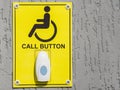 Wheelchair and handicap accessible entrance sign. Staff call button at the entrance to a public building Royalty Free Stock Photo