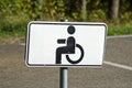 Wheelchair Handicap Sign in resort park road Royalty Free Stock Photo