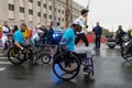 Wheelchair paraplegic athletes racing in street marathon