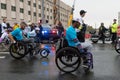 Wheelchair paraplegic athletes racing in street marathon