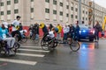 Wheelchair paraplegic athletes racing in street marathon