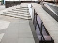 Wheelchair ramp for disabled people at a large modern office building, store. Accessibility for business trips for the disabled Royalty Free Stock Photo