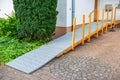 Wheelchair ramp fitted to front of family house, barrier-free zone Royalty Free Stock Photo