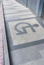 Wheelchair ramp with information sign on floor