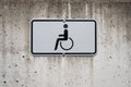 Wheelchair symbol on sign - handicapped parking spot Royalty Free Stock Photo