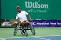 A wheelchair tennis player during a tennis championship match, t