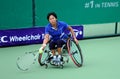 A wheelchair tennis player during a tennis championship match, t