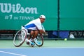 A wheelchair tennis player during a tennis championship match, t