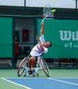 A wheelchair tennis player during a tennis championship match, t