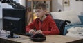 Wheelchaired boy using computer