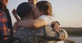 Wheelchaired soldier hugging his daughter