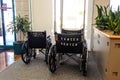 Wheelchairs with Cancer Center on back in waiting room