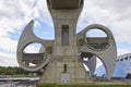 The Wheeled Caissons of the Falkirk wheel slowly rotating into Position, with the Visitor Information Centre on the far right.