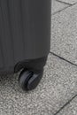 The Wheeled luggage travel bag on concrete texture ground.