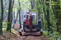 Wheeled Tractor transports on a trailer micro excavator Royalty Free Stock Photo