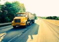 18 wheeler dump truck on highway road at sunrise