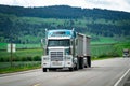 18 wheeler semi truck delivering cargo on the road