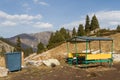 Wheelie bin with a gazebo in the mountains