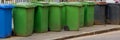 Wheelie bins in row for refuge collection outdoors Royalty Free Stock Photo