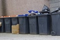 Wheelie bins in row for refuge collection outdoors Royalty Free Stock Photo