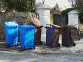 Wheelie bins in row segregated for recycling rubbish