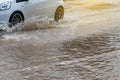 Wheels car sped through flooded.