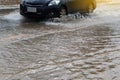 Wheels car sped through flooded.