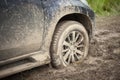 The wheels of the car are stuck in the mud. Off-road driving. Royalty Free Stock Photo