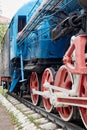 wheels and connecting rod drive of the locomotive on rails Royalty Free Stock Photo