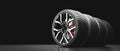 Wheels with modern alu rims on black Royalty Free Stock Photo