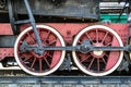 Wheels of the old locomotive of red color and the elements of the drive Royalty Free Stock Photo