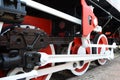 Wheels of an old steam locomotive close-up, wheels of a steam locomotive in red. Royalty Free Stock Photo