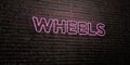 WHEELS -Realistic Neon Sign on Brick Wall background - 3D rendered royalty free stock image